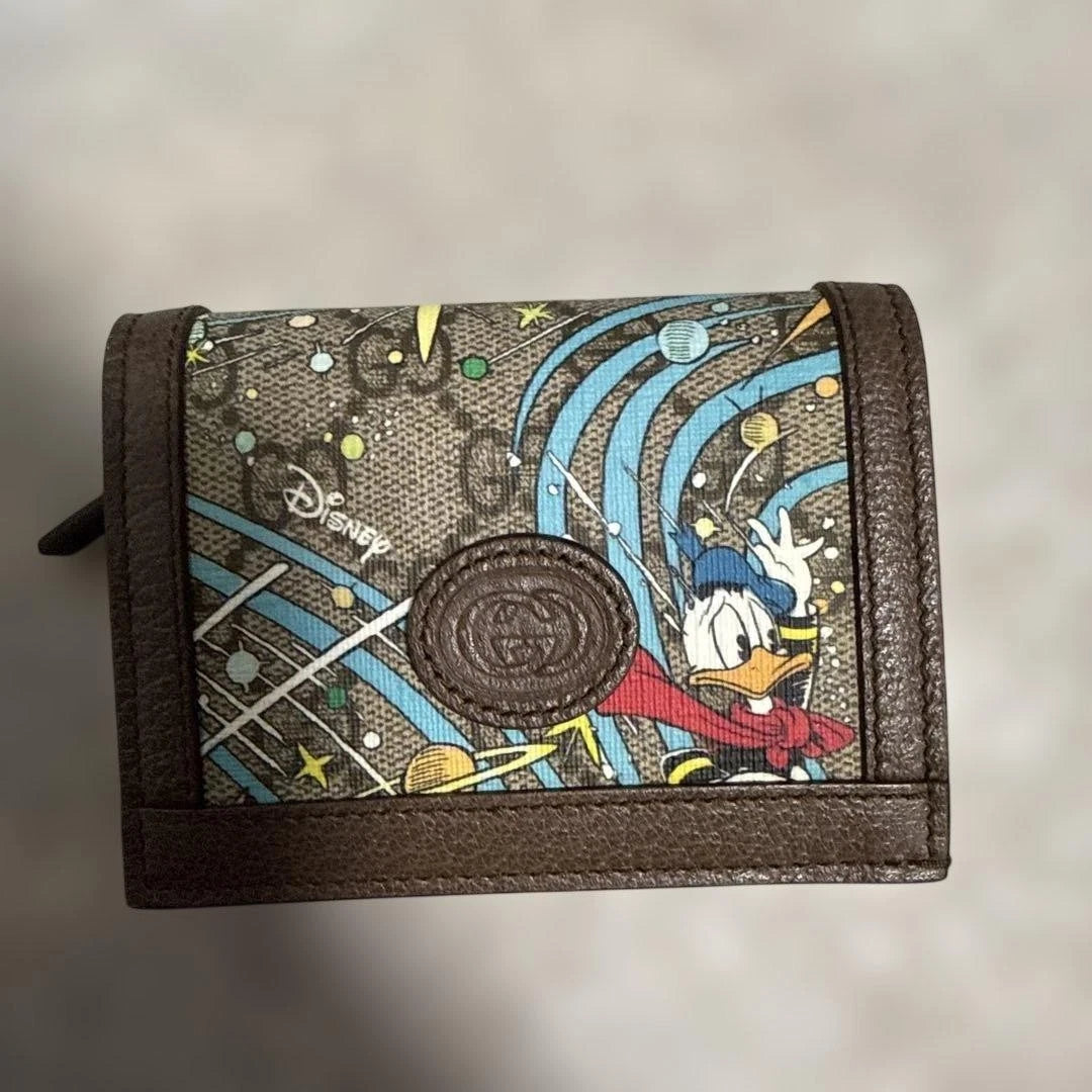 Gucci x Disney Donald Duck Bi-Fold Wallet – GG Supreme Canvas