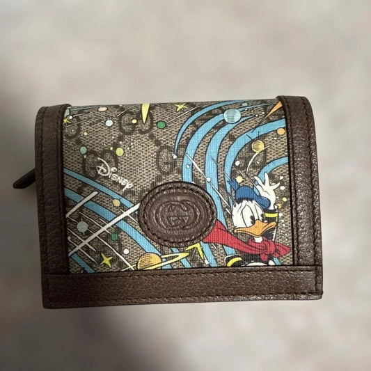 Gucci x Disney Donald Duck Bi-Fold Wallet – GG Supreme Canvas