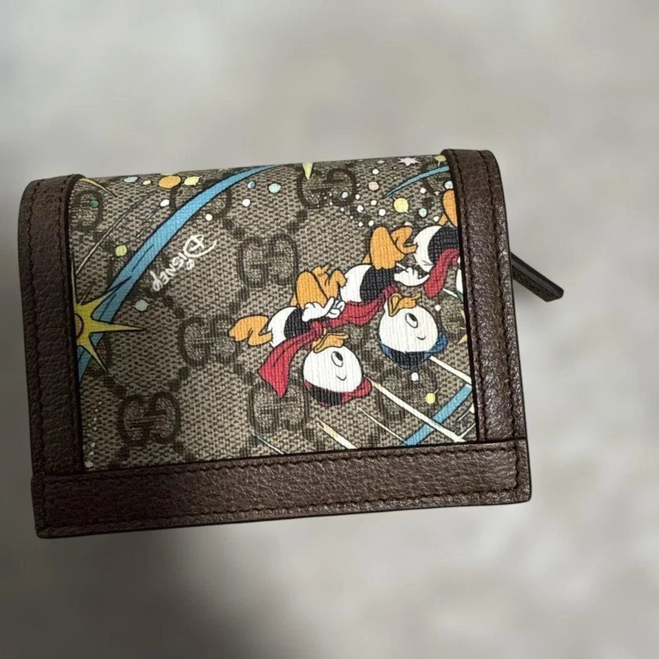 Gucci x Disney Donald Duck Bi-Fold Wallet – GG Supreme Canvas